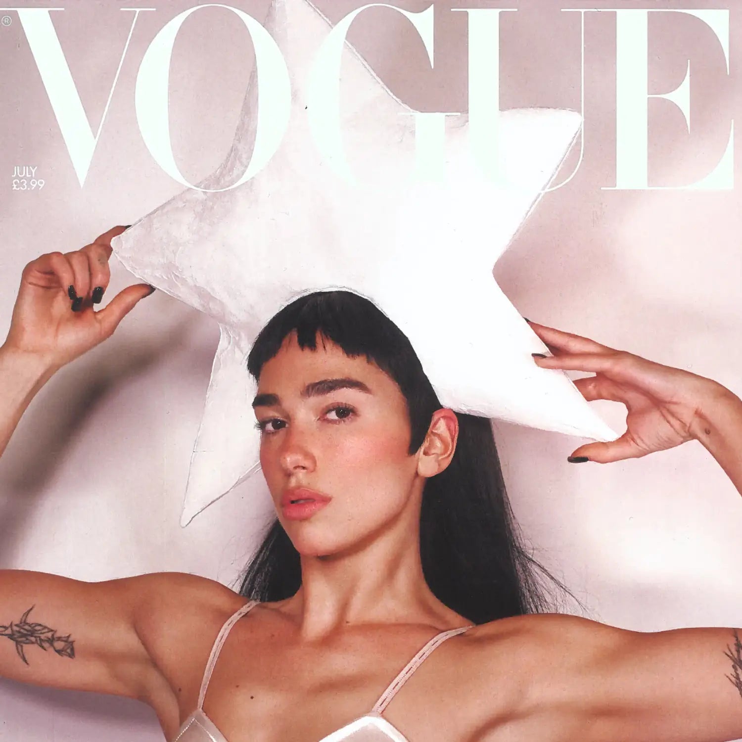 Dua Lipa in ivory star headpiece graces Vogue July 2025 cover in bold fashion.