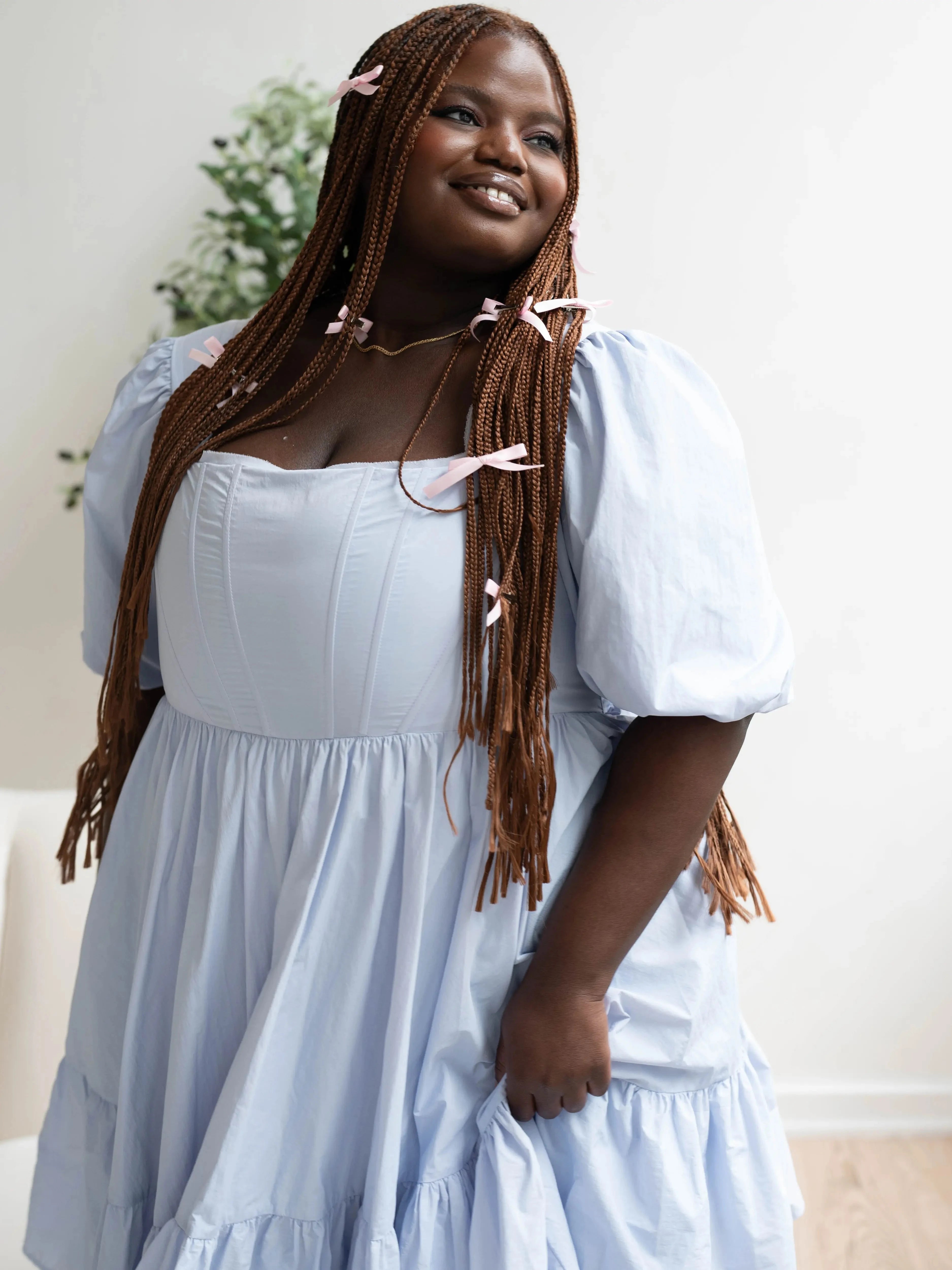 Close-up of Alice Blue Josephine Midi Dress highlighting puff sleeves and corset bodice. Blue midi dress with delicate coquette details.