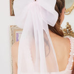 Close-up of Ballerina Pink Grand Hair Bow in silk organza, featuring oversized loops and long flowing tails.