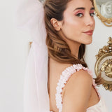 Side view of Ballerina Pink Grand Hair Bow in silk organza, adding a soft, elegant touch to a feminine hairstyle.