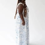 Side profile of the Blue Toile Angel Dress showing lace straps and flowing silhouette with a vintage-inspired blue toile pattern.
