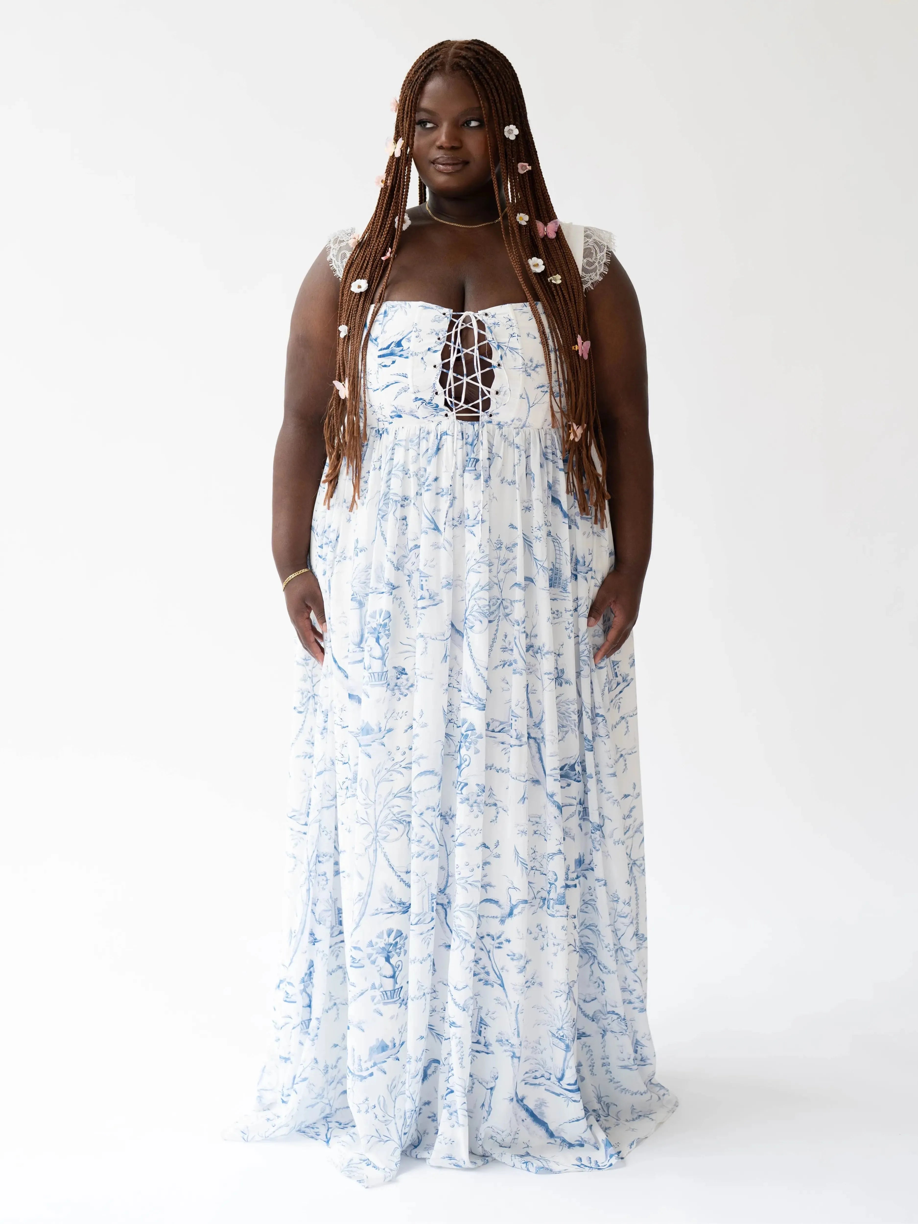 Front view of the Blue Toile Angel Dress featuring a lace-up corset bodice and flowing toile skirt.