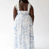 Back view of the Blue Toile Angel Dress with lace straps and full-length toile skirt.