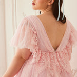 Back view of the Cherub Pink Lace Dress featuring intricate lace detailing and a low V-back design for a dreamy fairytale look.