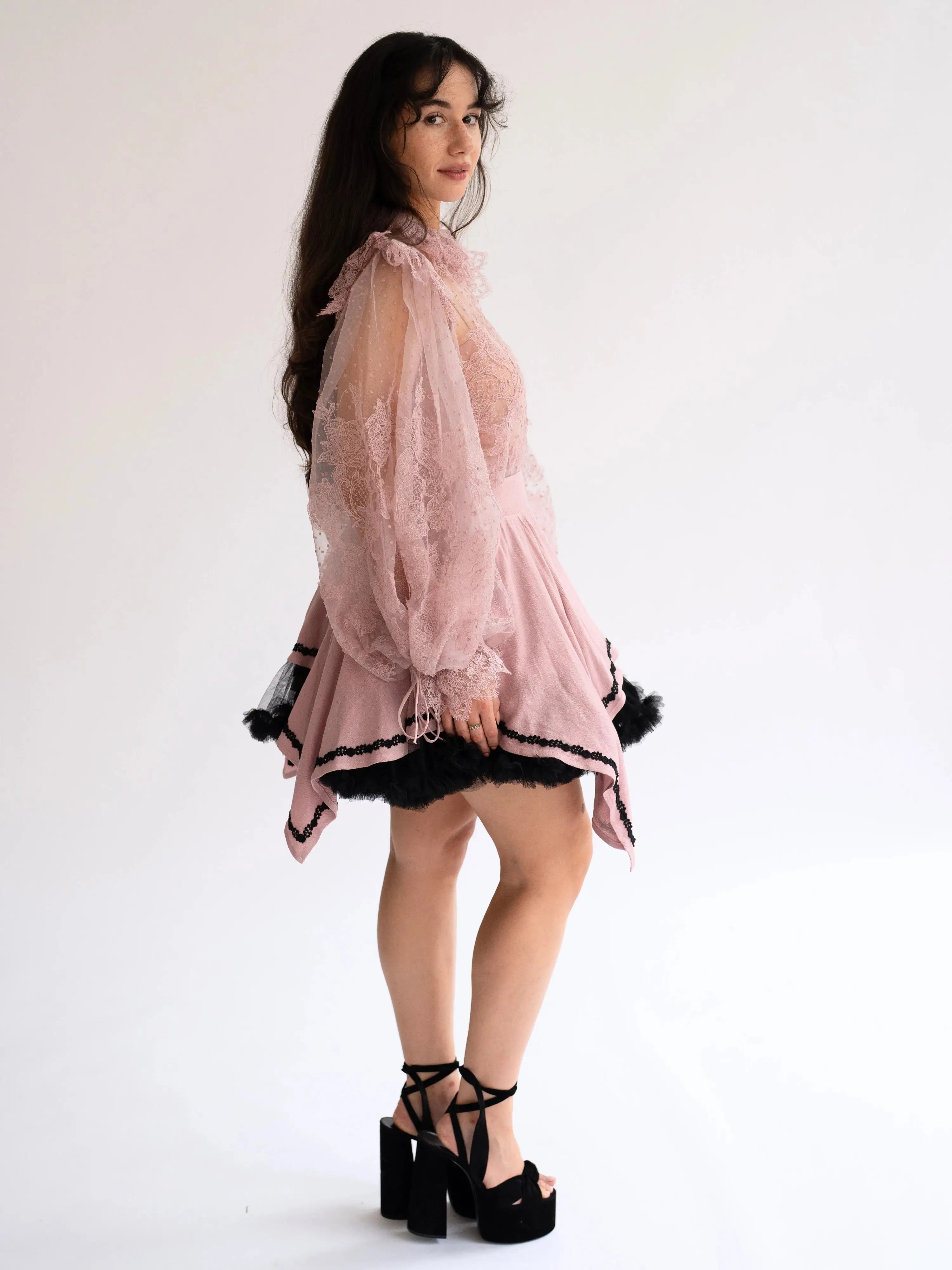 Side profile of Eleanor Dusty Pink Lace Blouse featuring puff sleeves and intricate lace, styled for a whimsical and vintage-inspired look.