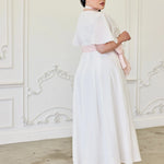 Side view of the Ivory Cloud Cotton Day Dress featuring flared silhouette and delicate Swiss dot cotton, perfect for bridal showers or garden parties.