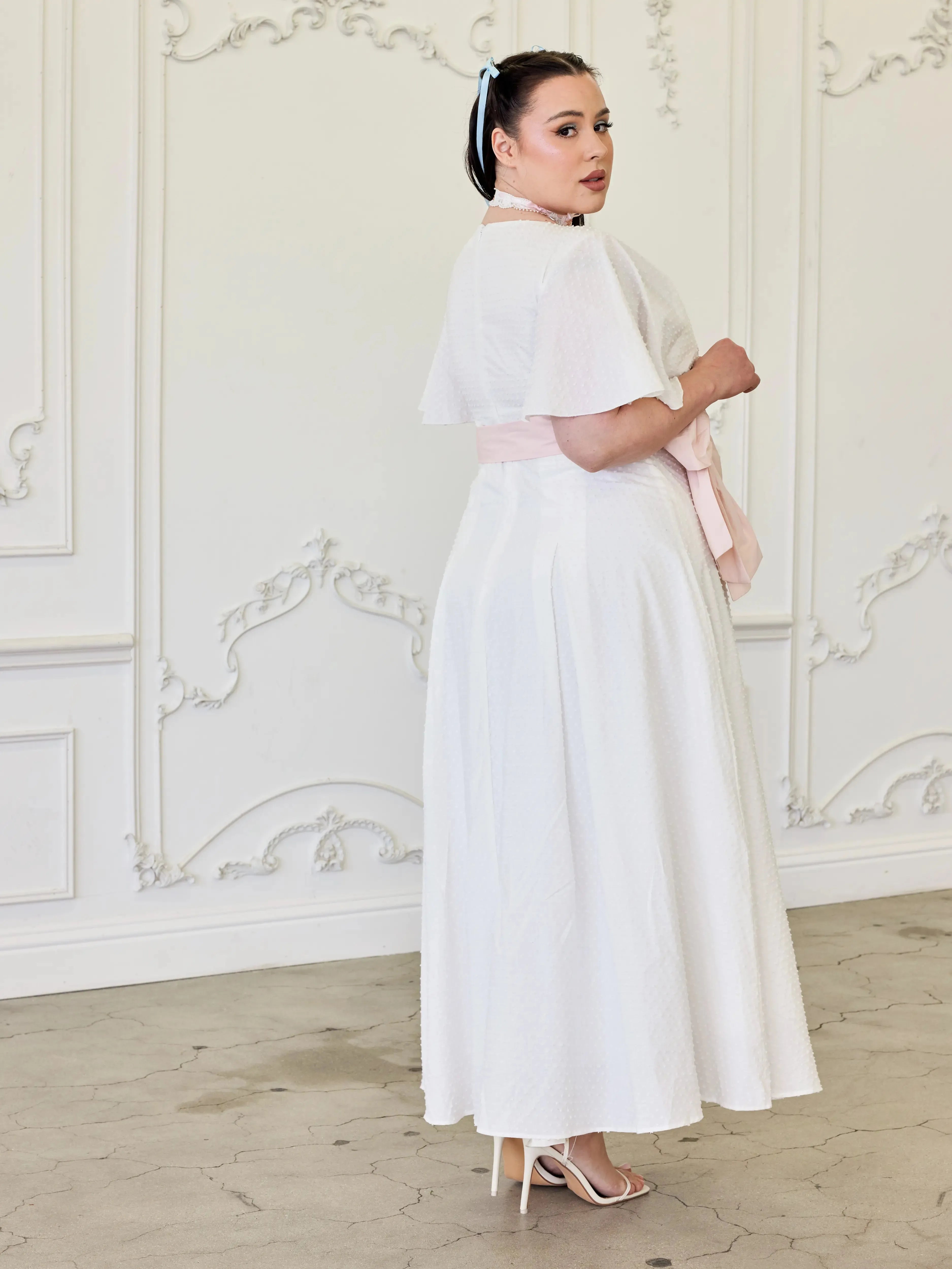 Side view of the Ivory Cloud Cotton Day Dress featuring flared silhouette and delicate Swiss dot cotton, perfect for bridal showers or garden parties.
