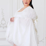Side view of Ivory Fairy Puff Sleeve Dress on plus-size model, featuring flowing sleeves and fairy-inspired silhouette.