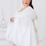 Side view of Ivory Fairy Puff Sleeve Dress on plus-size model, featuring flowing sleeves and fairy-inspired silhouette.
