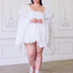 Plus-size model wearing Ivory Fairy Puff Sleeve Dress with flared skirt and pink heels, part of the In-Bloom Collection N.3.