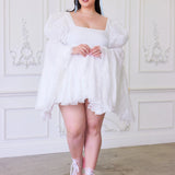 Plus-size model wearing Ivory Fairy Puff Sleeve Dress with flared skirt and pink heels, part of the In-Bloom Collection N.3.