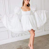 Ivory Fairy Puff Sleeve Dress with dramatic tulle sleeves and lace details, styled for women's dresses & gowns in a whimsical setting.