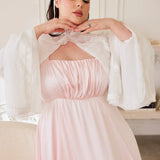 Ivory Lady Elizabeth Bolero Jacket featuring ruffled lace trim and flowing bell sleeves over a blush pink dress.