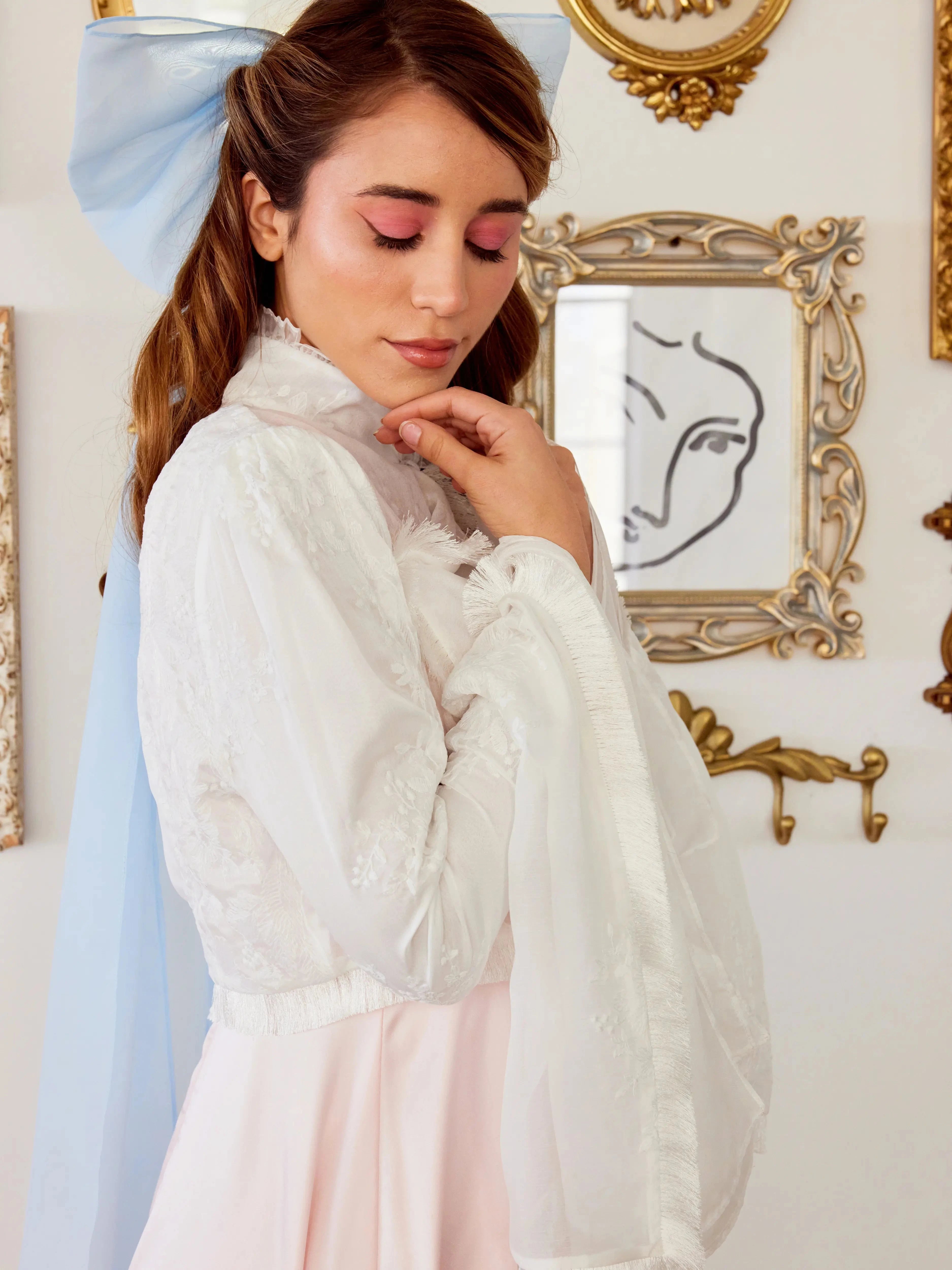 Side view of the Ivory Lady Elizabeth Bolero Jacket showcasing sheer lace fabric, romantic bell sleeves, and elegant high neck design.