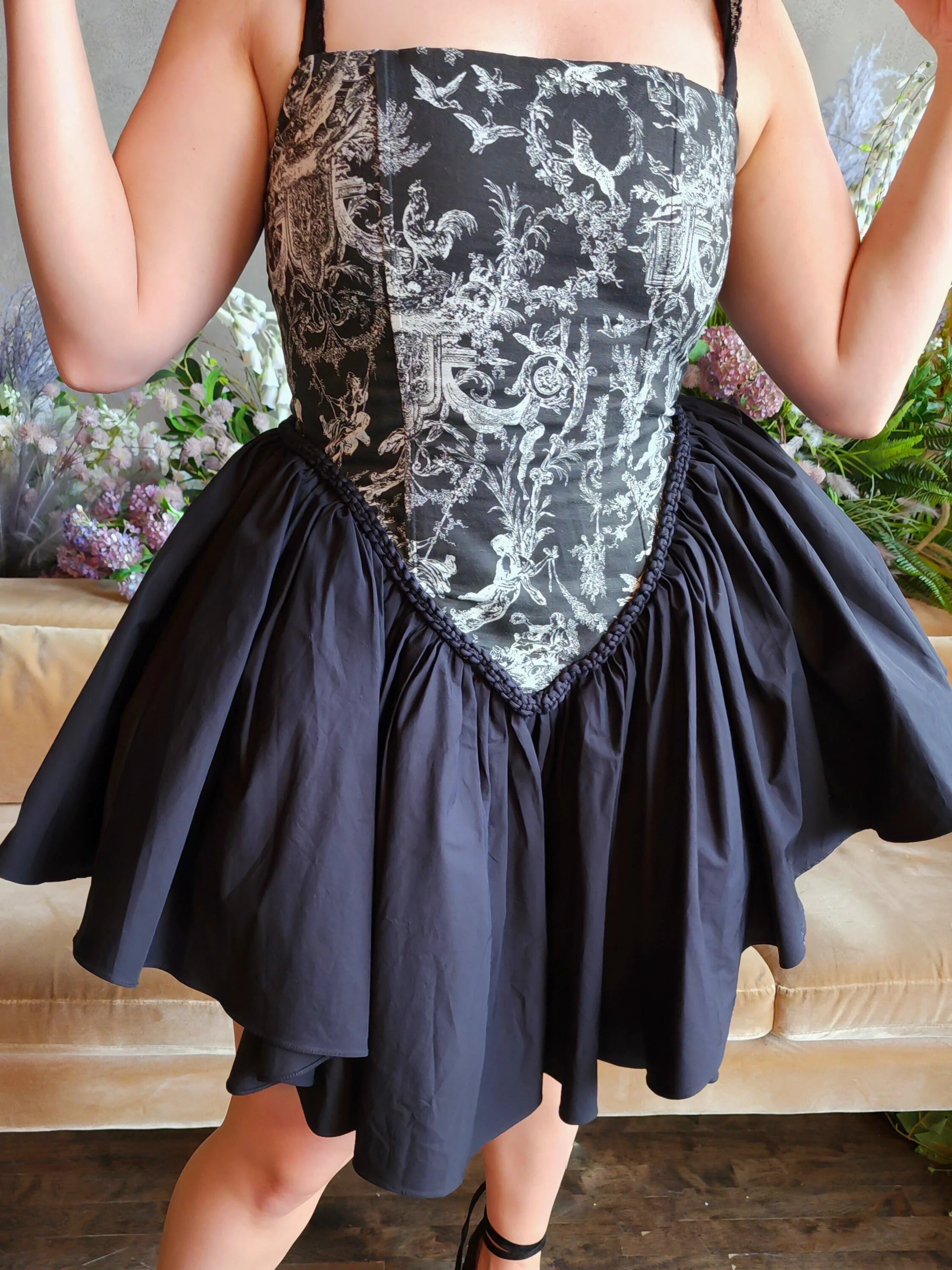 Strapless Rhiannon Corset Dress featuring patterned corset bodice and a black skirt with tulle underneath for a puff effect.