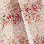 Close-up of the Rosewater Grand Bow Belt's custom floral satin fabric, showcasing intricate rose print in soft pink and green hues.