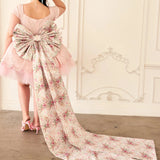 Full view of the Rosewater Grand Bow Belt with extra-long floral satin tails, styled for a Bridgerton-inspired fashion statement.