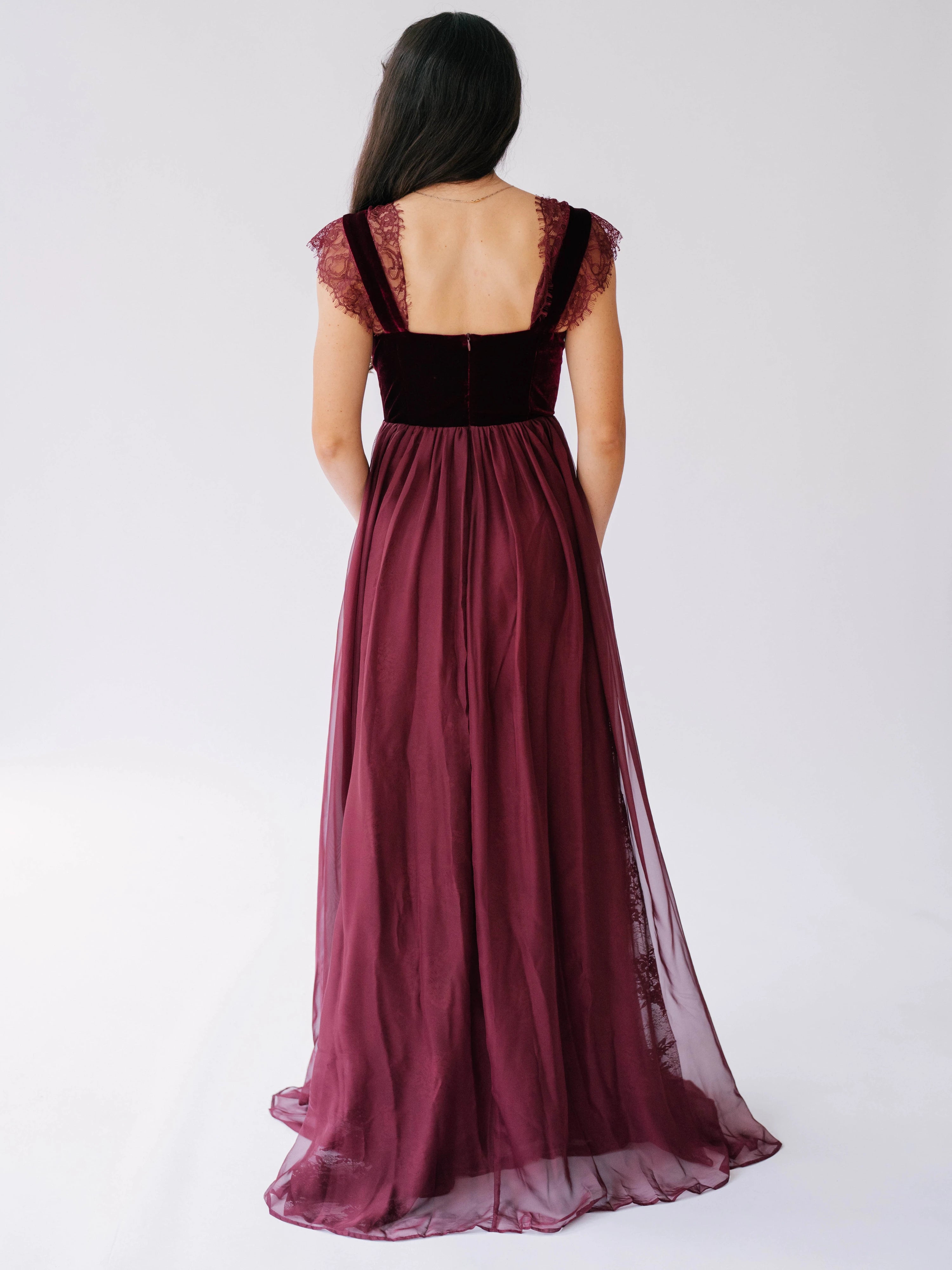 Scarlet red floor-length gown with velvet corset bodice and flowing chiffon skirt.