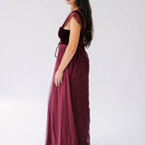 scarlet red floor-length gown with lace cap sleeves and a velvet corset bodice.