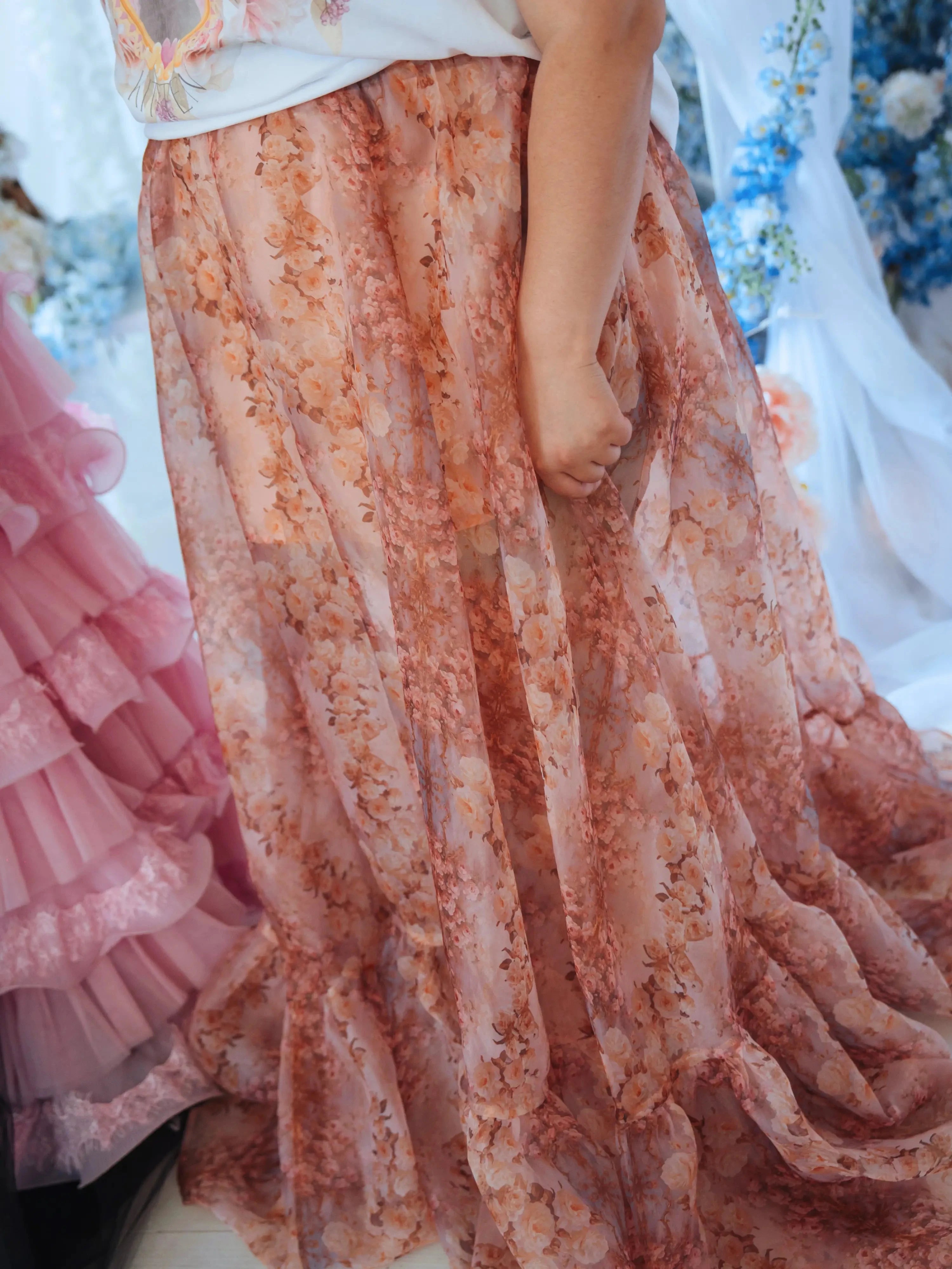 Side view of The Twilight Bloom Bustle Skirt’s flowing floral organza fabric, emphasizing its dreamy fairytale aesthetic.