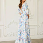 The Wildbloom Josephine Ball Gown - A floral Ball Gown back view with lace-up detail and ruffled maxi skirt in a classic interior.