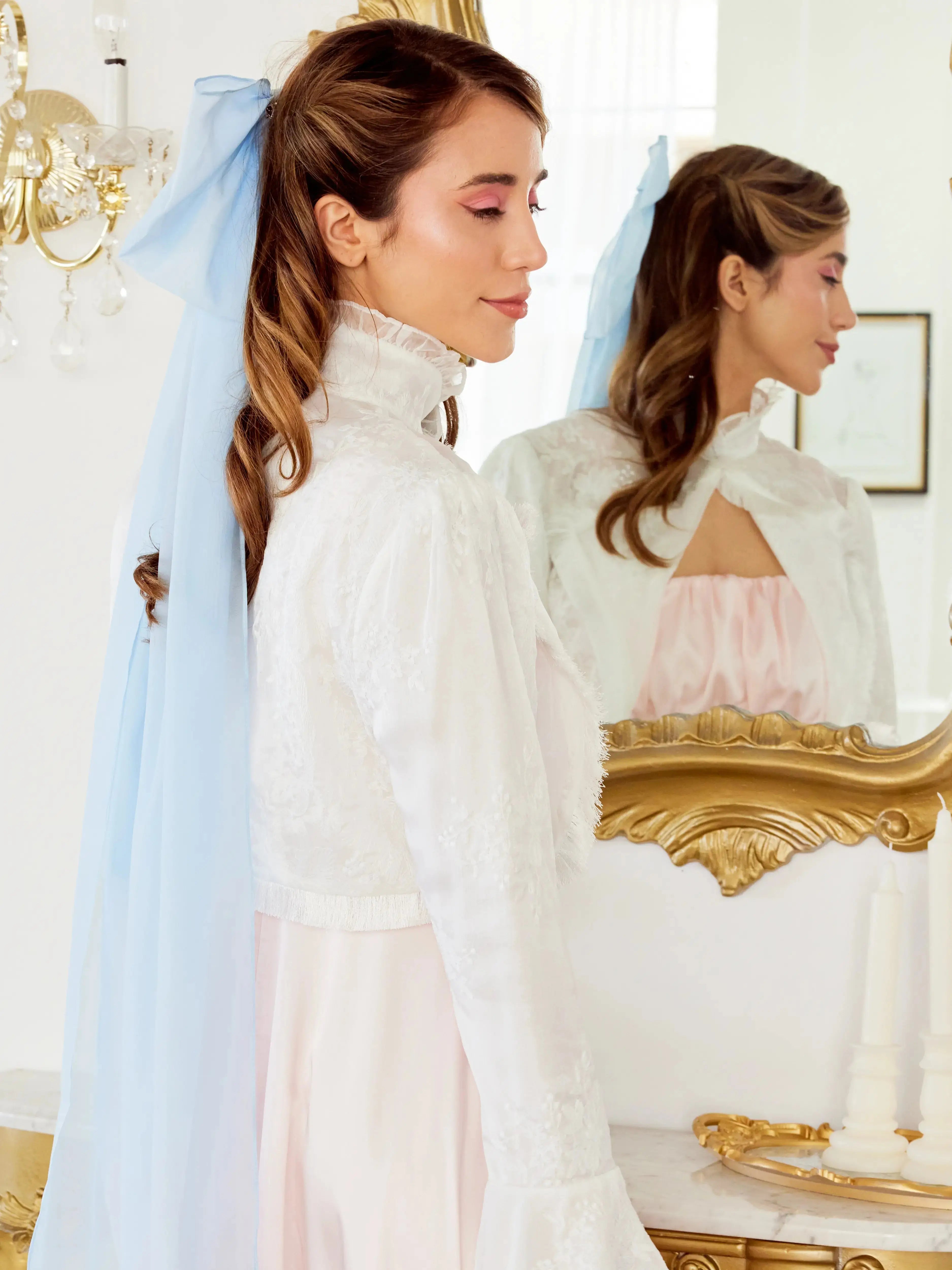 Caylee wearing the Alice Blue Grand Hair Bow featuring dreamy 36-inch tails, styled with a high-neck embroidered blouse for an ethereal aesthetic.