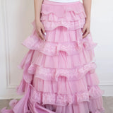 Front view of the dahlia pink ruffle skirt, intricate lace, and ruffle details.