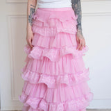 The Dahlia Ruffle Skirt | Fantasy Skirts detailed view of pink ruffles and lace tiers, styled with a whimsical printed tee for a playful look.