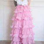 The Dahlia Ruffle Skirt | Fantasy Skirts rear view showing layered pink tulle and lace ruffles, styled with a knotted white tee for contrast.