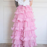 The Dahlia Ruffle Skirt | Fantasy Skirts rear view showing layered pink tulle and lace ruffles, styled with a knotted white tee for contrast.