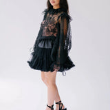 Side view of The Eleanor Midnight Black Lace Top showcasing romantic puff sleeves and delicate lace detailing for a gothic fairytale look.