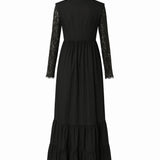 A back view of a black cotton dress called the Eveline dress, with lace sleeves and hem on a white background