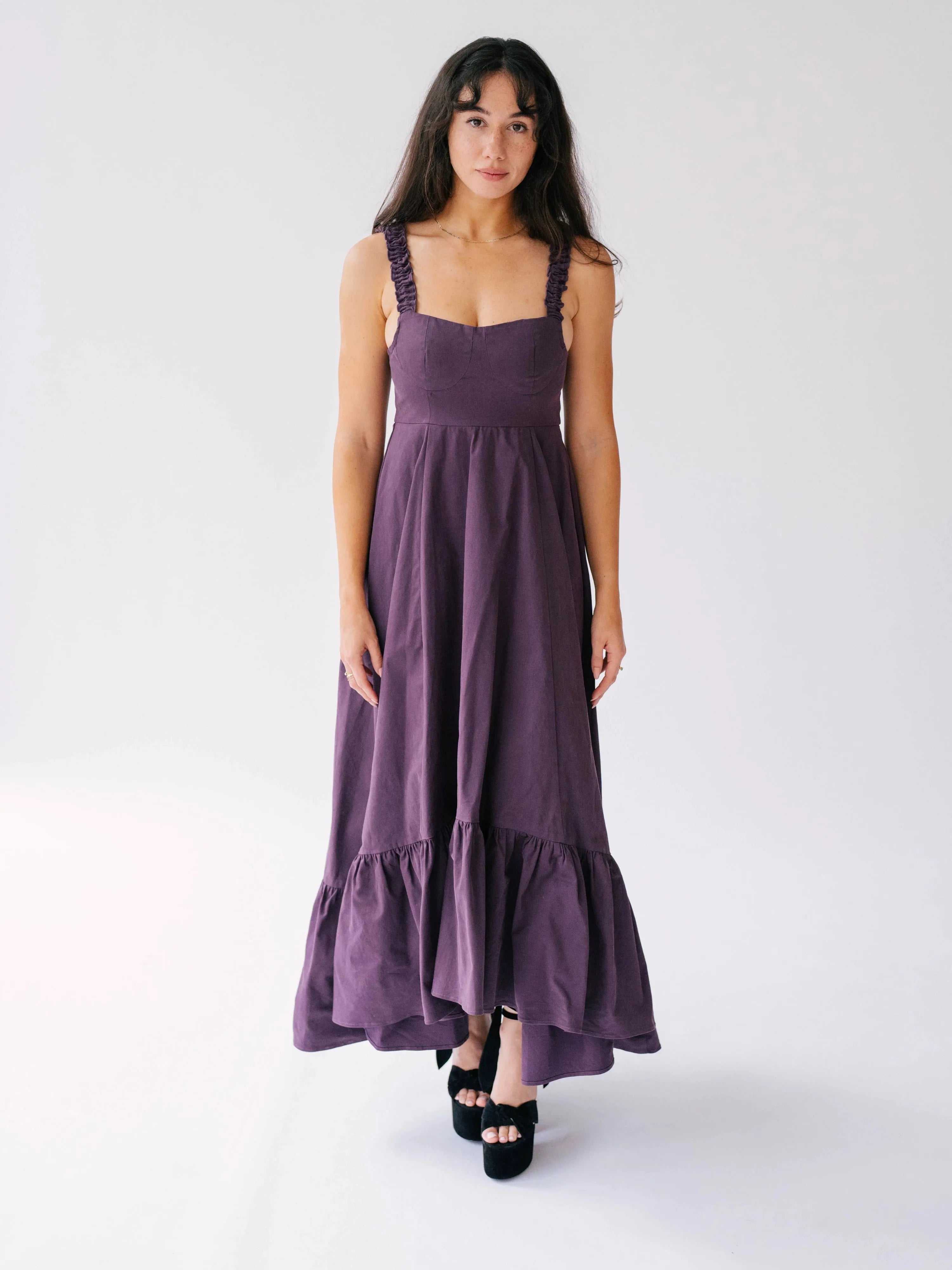 The Everyday Cotton Midi Dress in deep purple with ruched straps and high-low hem.