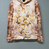 Flat lay of The Twilight Bloom Pullover Hoodie on hanger, showcasing front floral design. A cozy, romantic hoodie top for everyday wear.