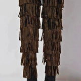 Rear view of The Fringe Thigh High Boots by Azalea Wang highlighting tiered fringe with gold studs and sleek black stiletto heels.