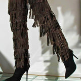 The Fringe Thigh High Boots by Azalea Wang with gold studded fringe and stiletto heels, styled for a bold over-the-knee fashion statement.