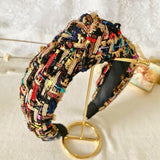 Colorful tweed headband with intricate patterns, perfect for a gown or grand bow sash