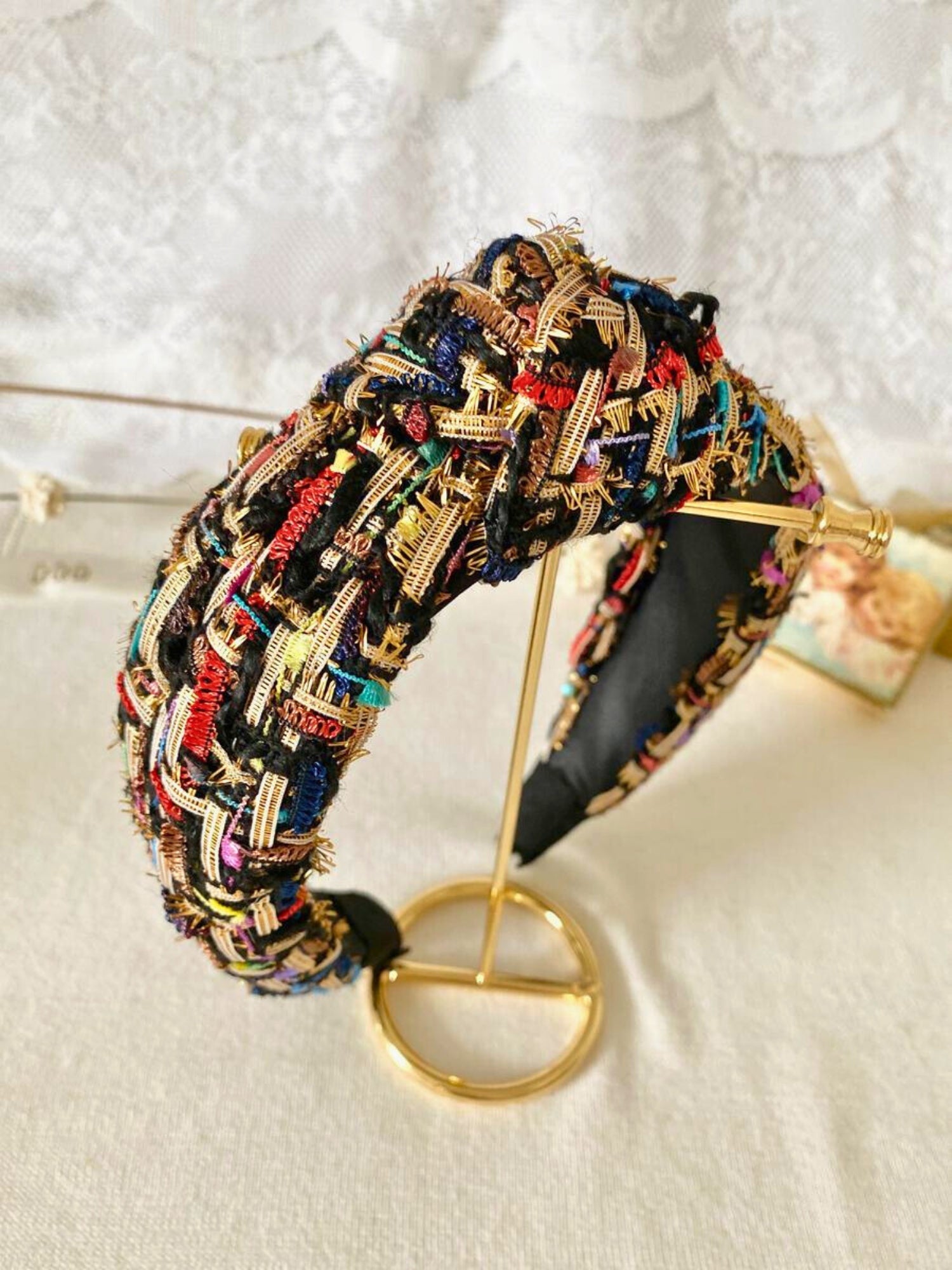 Colorful tweed headband with intricate patterns, perfect for a gown or grand bow sash