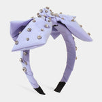 Lavender Bow Headband featuring a bow and sparkling rhinestone embellishments.