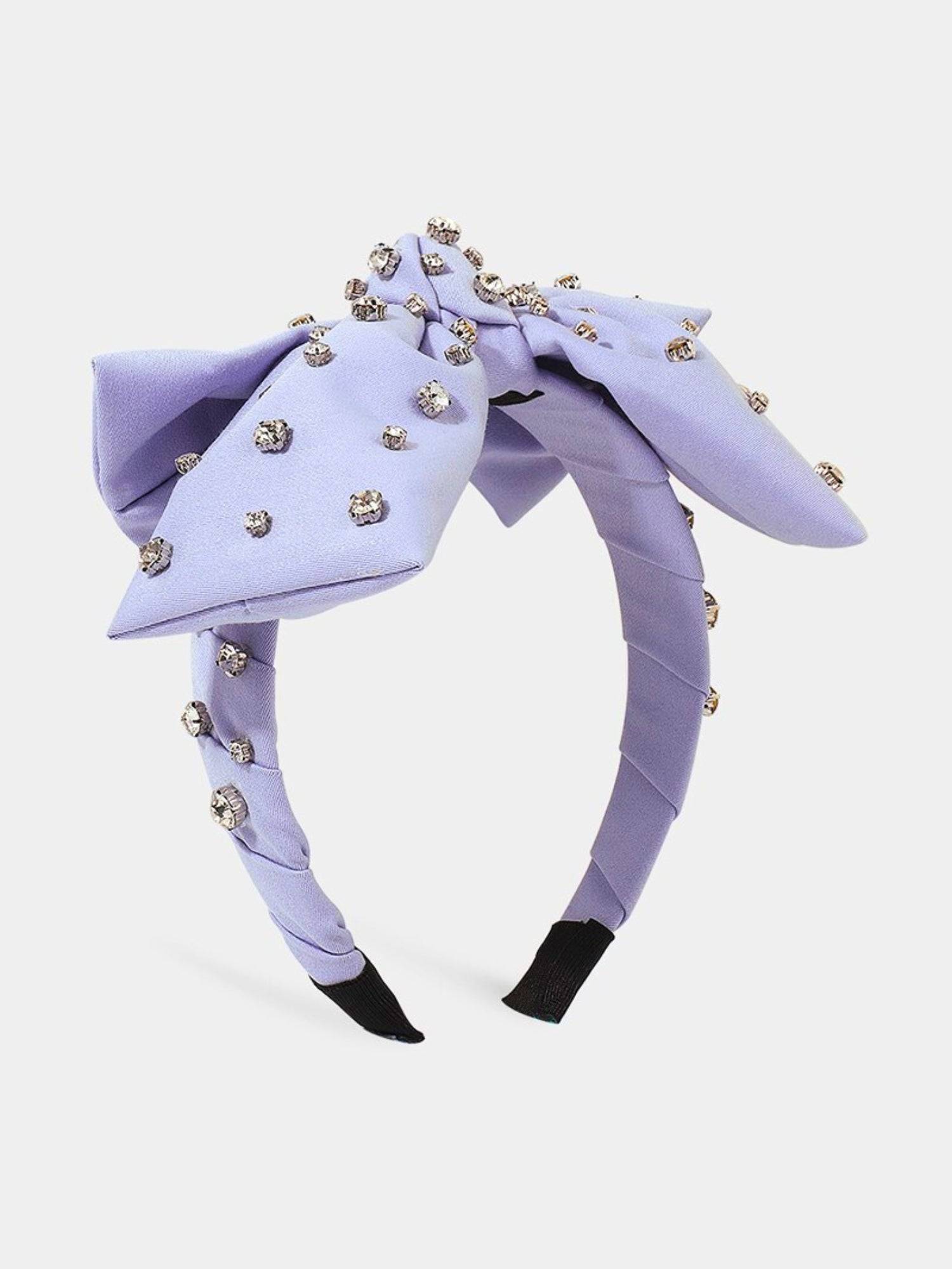 Lavender Bow Headband featuring a bow and sparkling rhinestone embellishments.