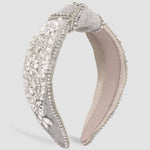 Ornate Tweed Headband adorned with pearls and crystals on light fabric base.