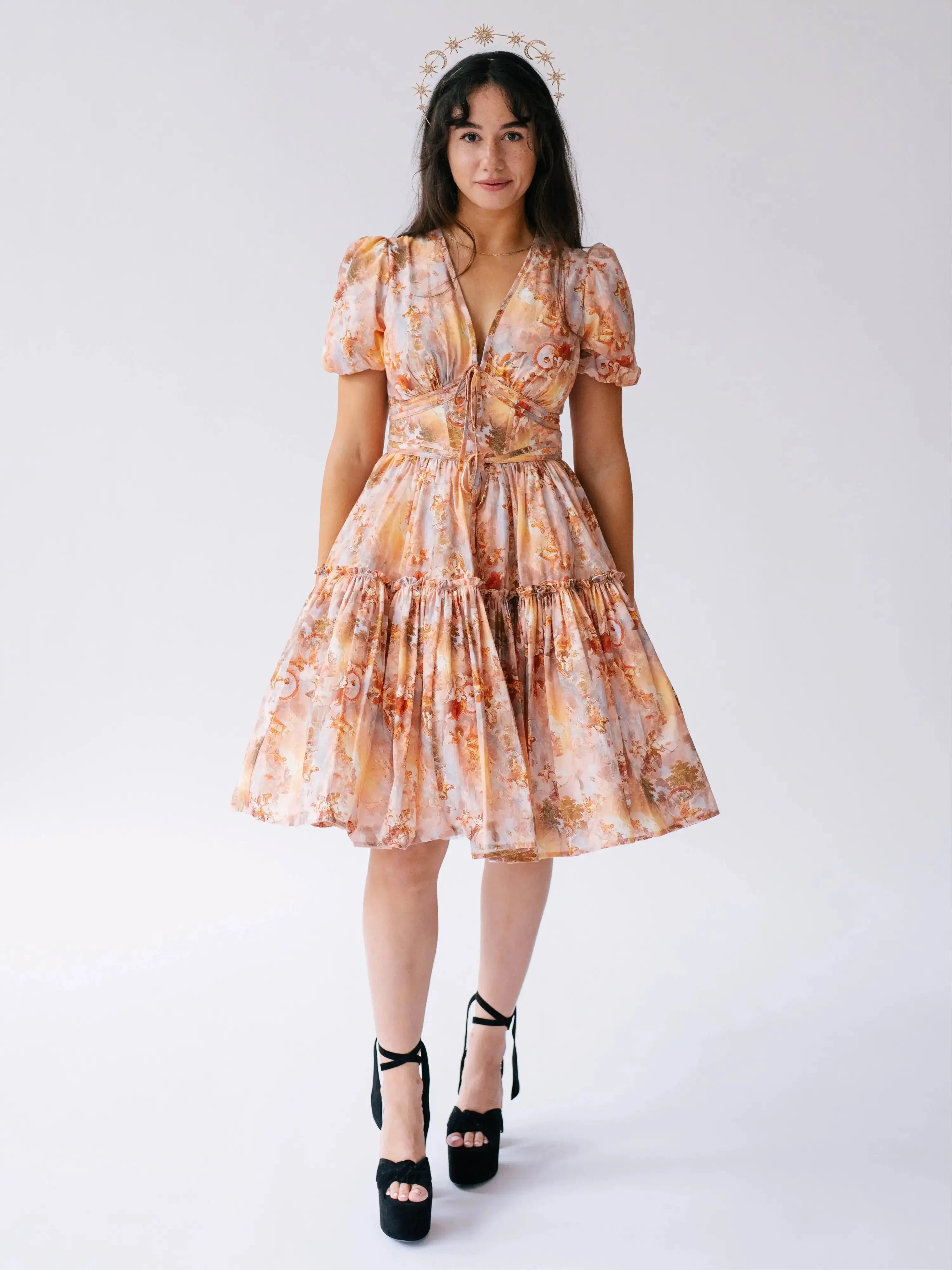 Ode To Jove Grace Day Dress featuring puff sleeves, V-neckline, and tiered mini skirt in soft fresco print. Ideal for spring and summer occasions.