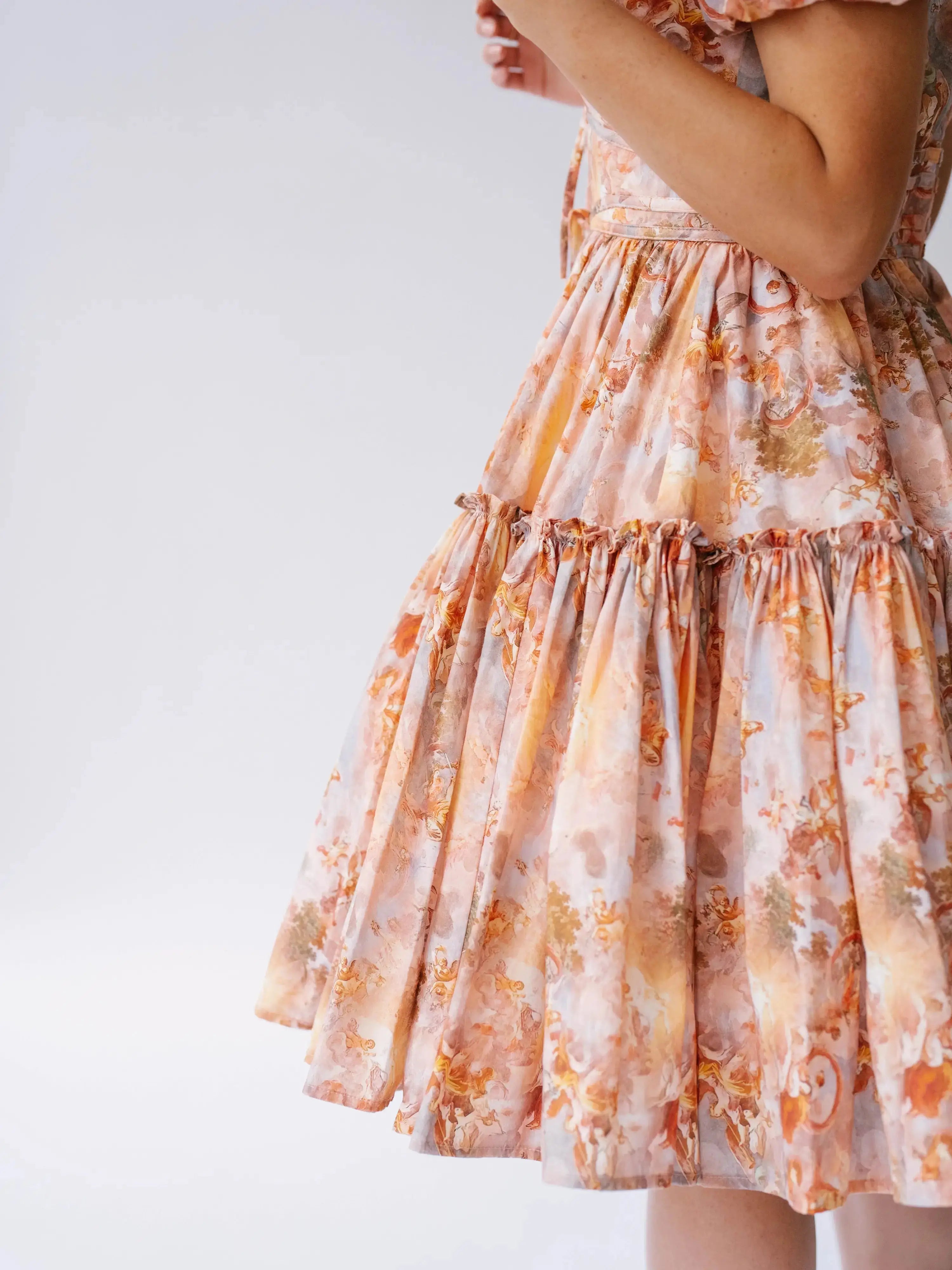 Side detail of Ode To Jove Grace Day Dress highlighting the swishable full skirt and soft cotton fabric. Ideal for movement and comfort.