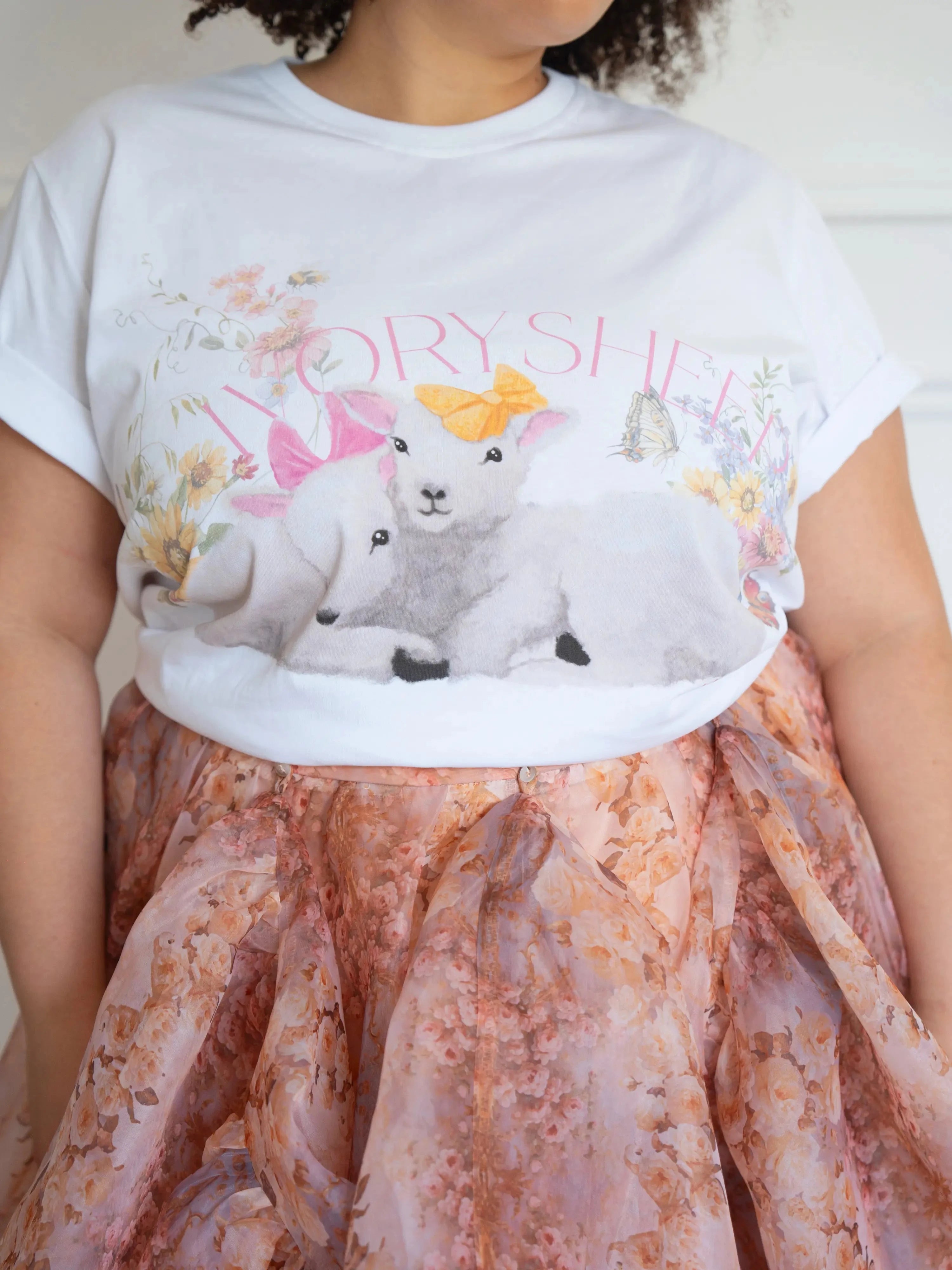 Close-up of The Little Lamb Tee highlighting detailed lamb and wildflower print, perfect for whimsical and cozy cottagecore outfits.