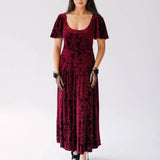 The Scarlet Red Velvet Viola Dress with butterfly sleeves and Victorian pattern, styled with black hat and gloves.