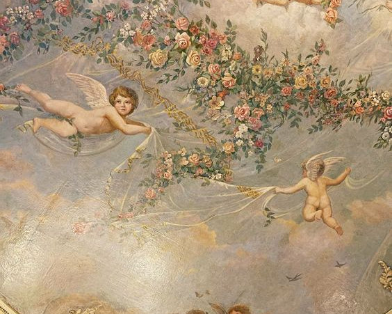 Ceiling Fresco of cherubs and florals dancing across a sky