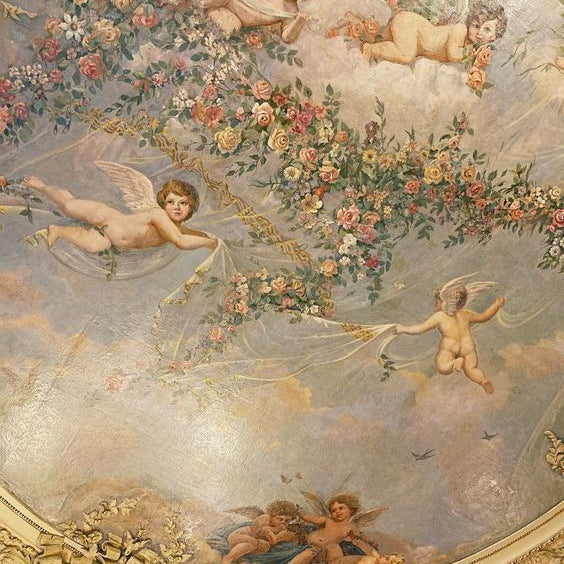 Ceiling Fresco of cherubs and florals dancing across a sky