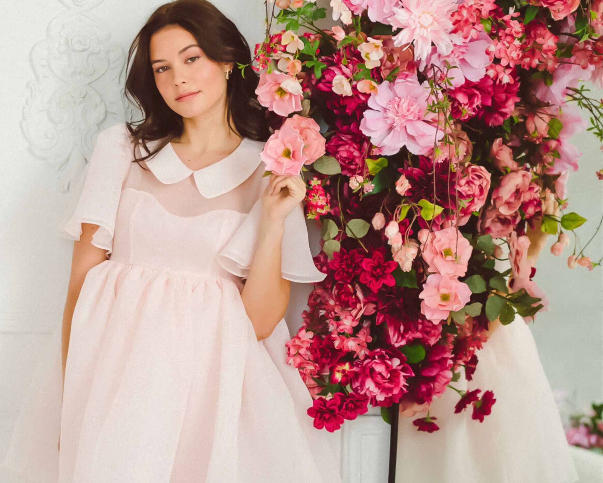 Girl wearing a pink puff dress with pink florals