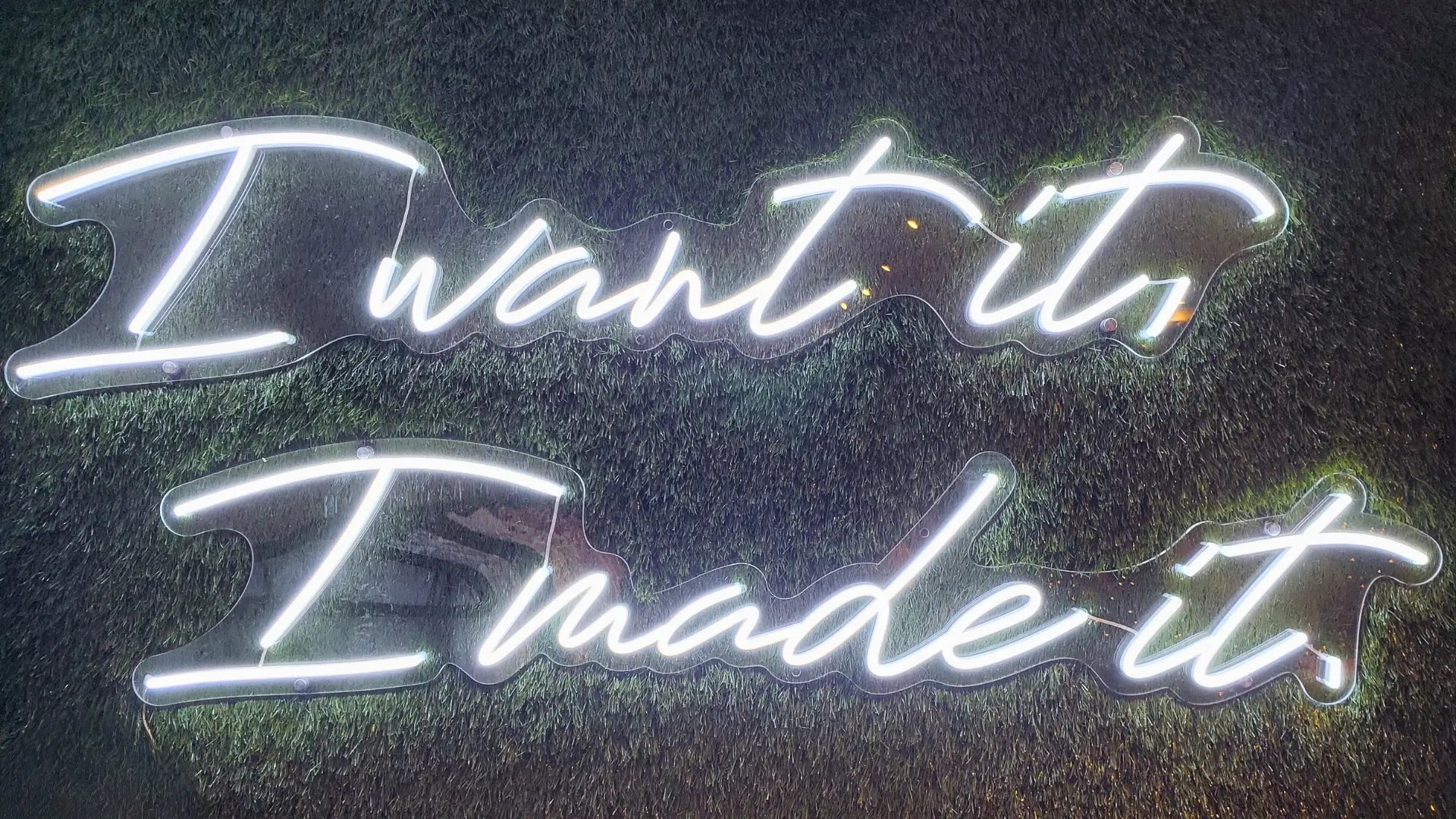 Neon sign reading I want it, I made it in fashion industry article Behind The Grass Wall