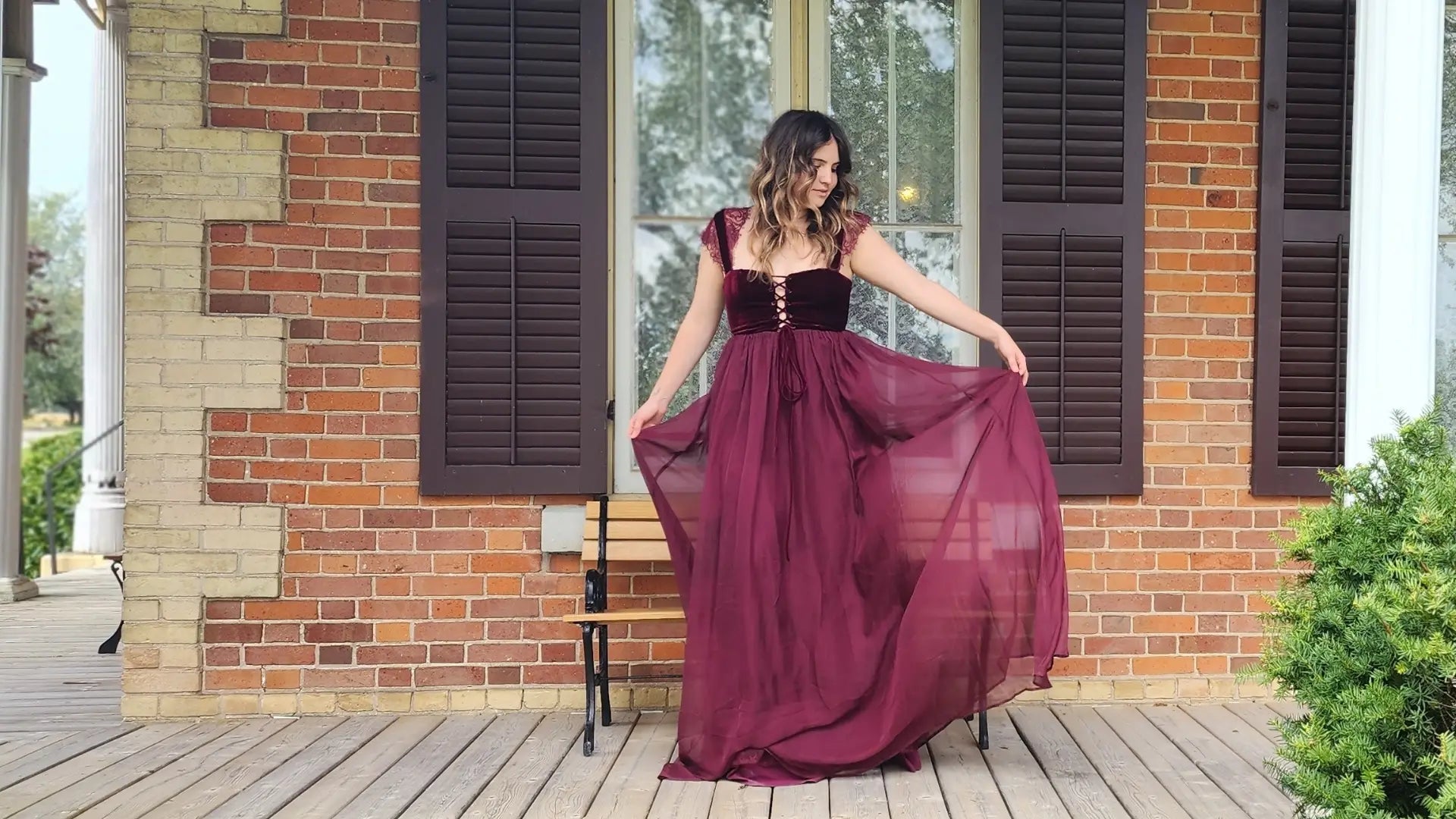 Flowing burgundy gown with tulle skirt, part of the Scorned Lovers’ collection.